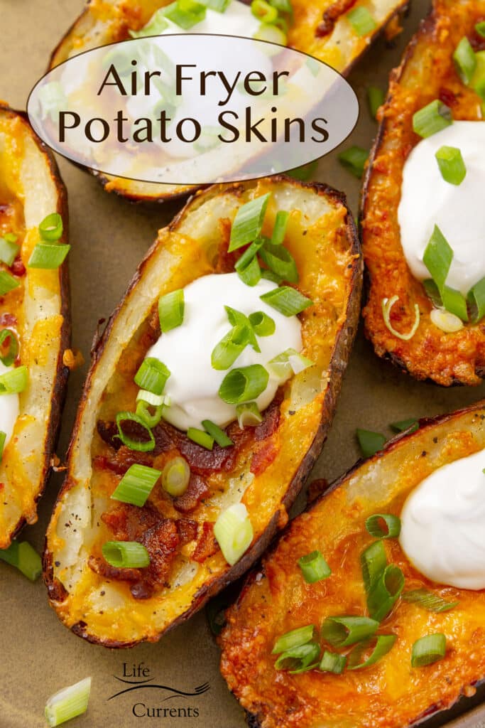 looking down on air fryer potato skins on a brown plate.