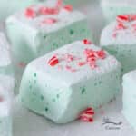 green peppermint marshmallows with crushed candy canes on top.
