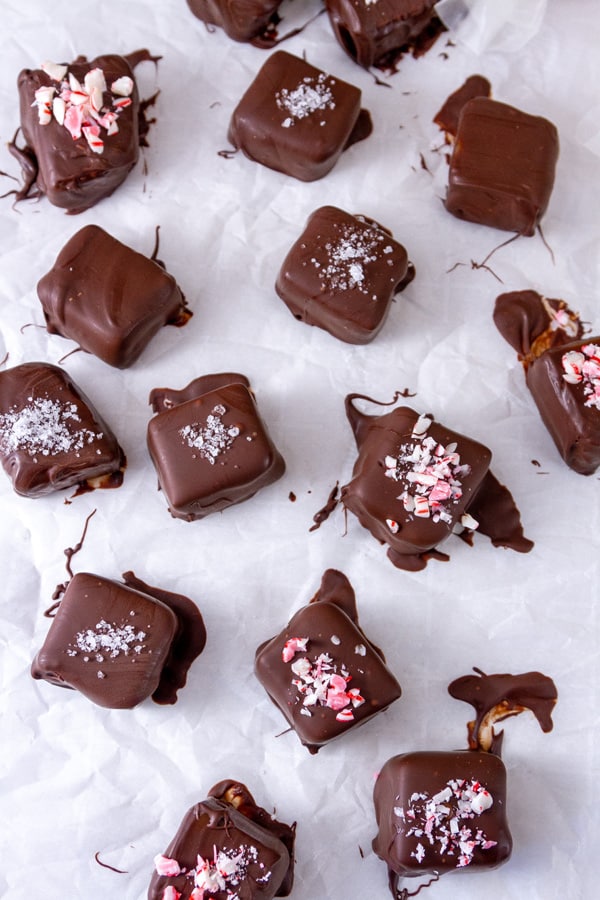 chocolate dipped candies garnished with crushed peppermints and salt.