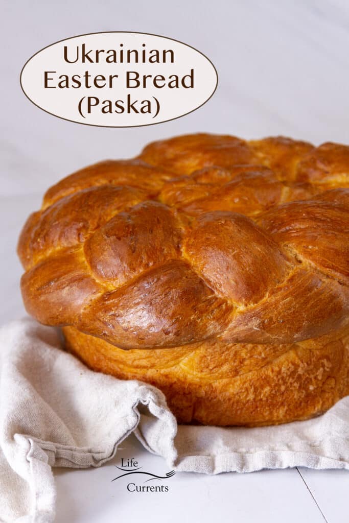 a loaf of Ukrainian Easter Bread (Paska) on a cloth napkin with the title in upper left.