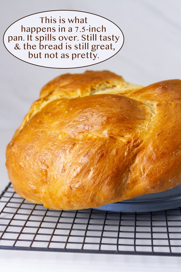 baked bread that has spilled over the edge of the pan.