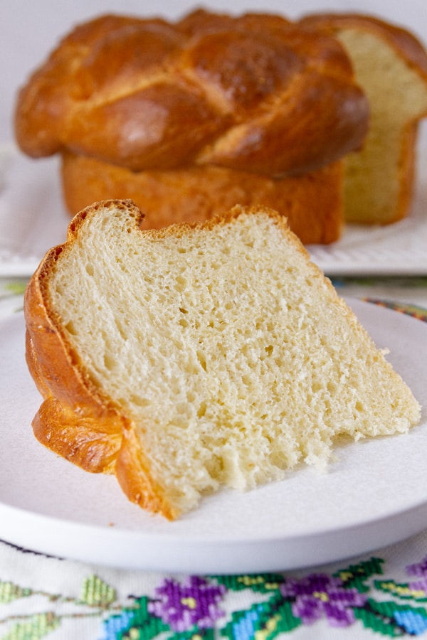 a wedge of bread with the loaf behind it.