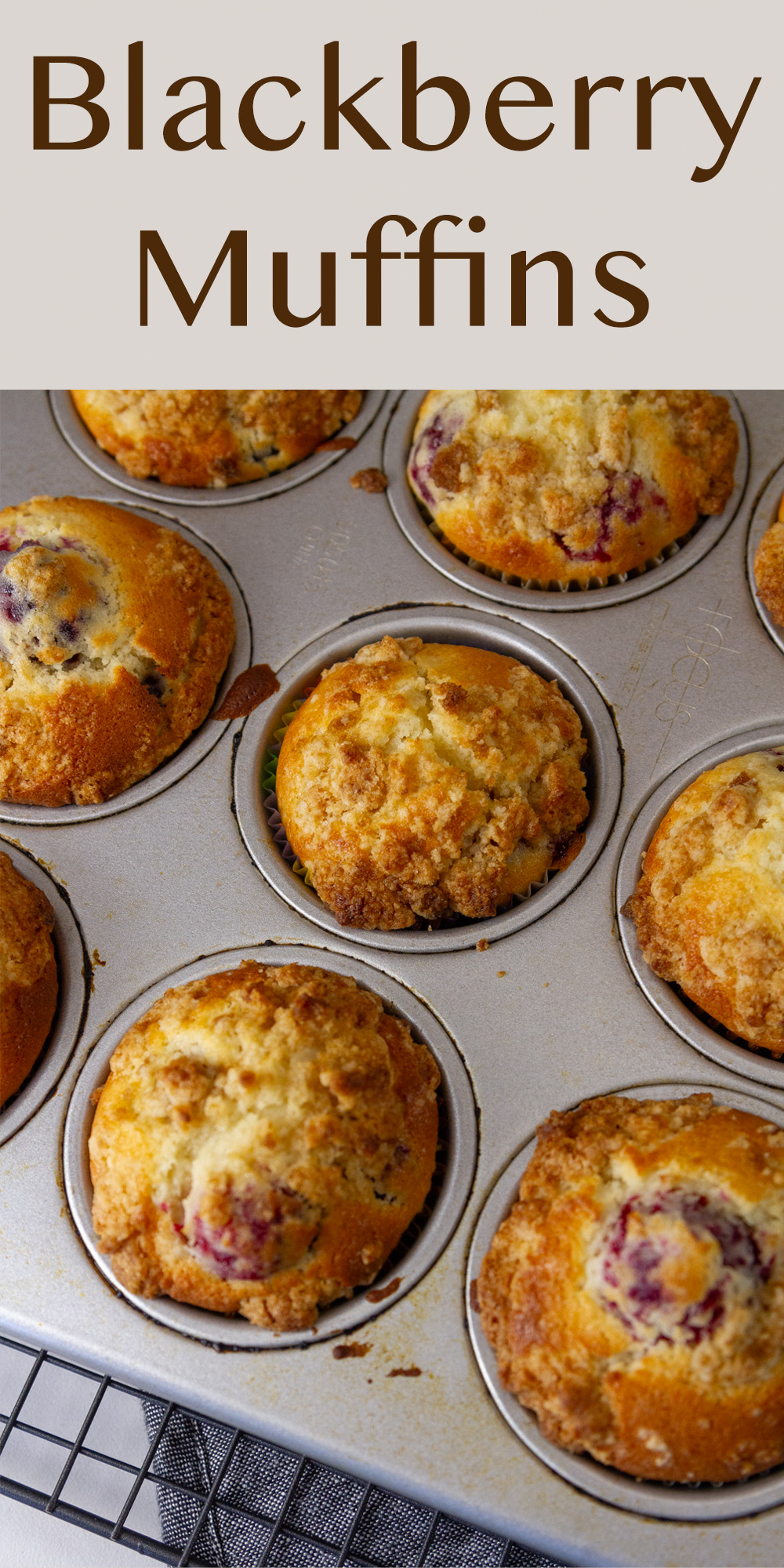 muffins in a muffin pan and the pan in on a wire cooling rack.