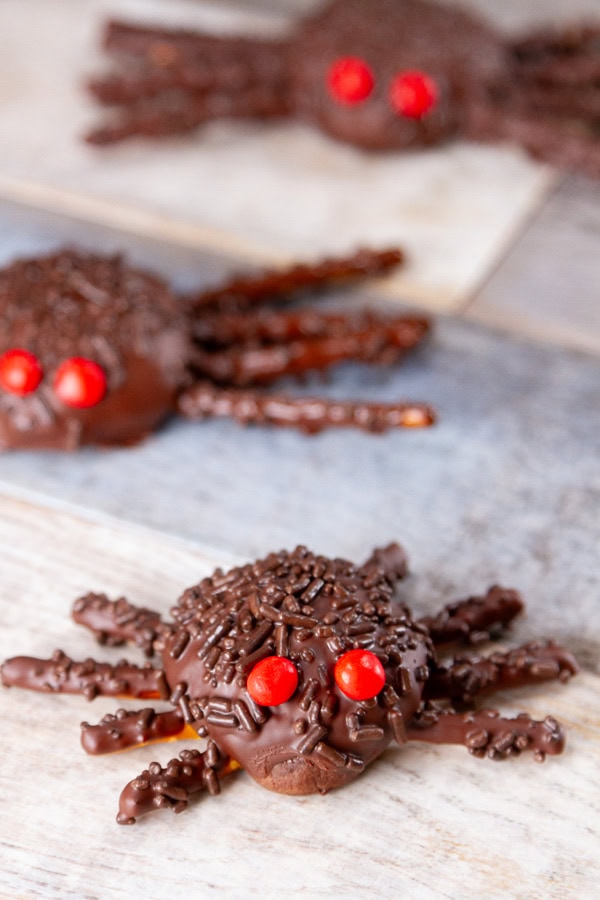 Halloween spider cookies on tiles.