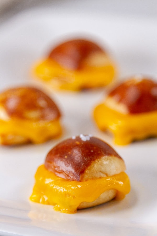 mini grilled cheese sandwiches on pretzels.