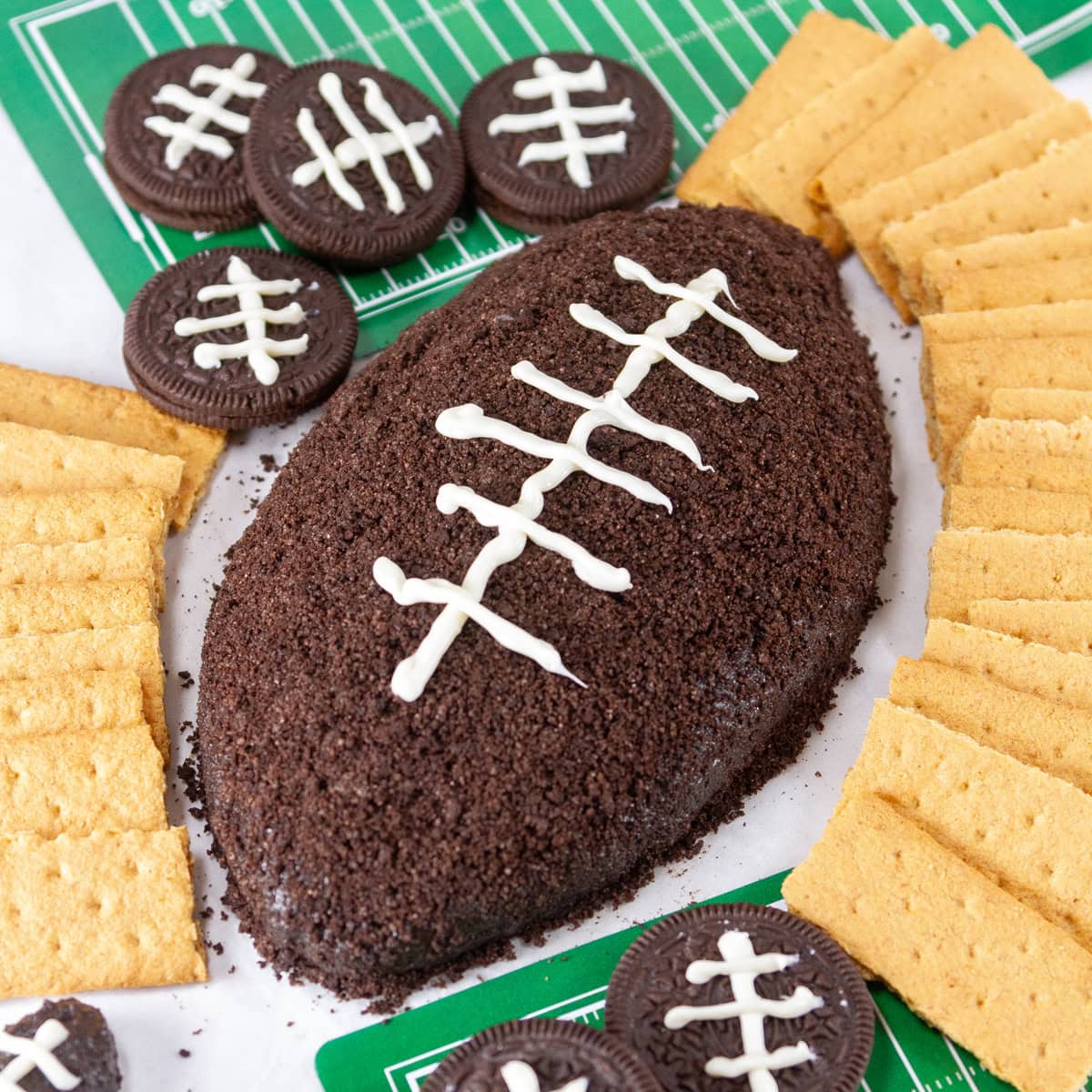 square crop of cookies and cream football with graham crackers and football decorations.