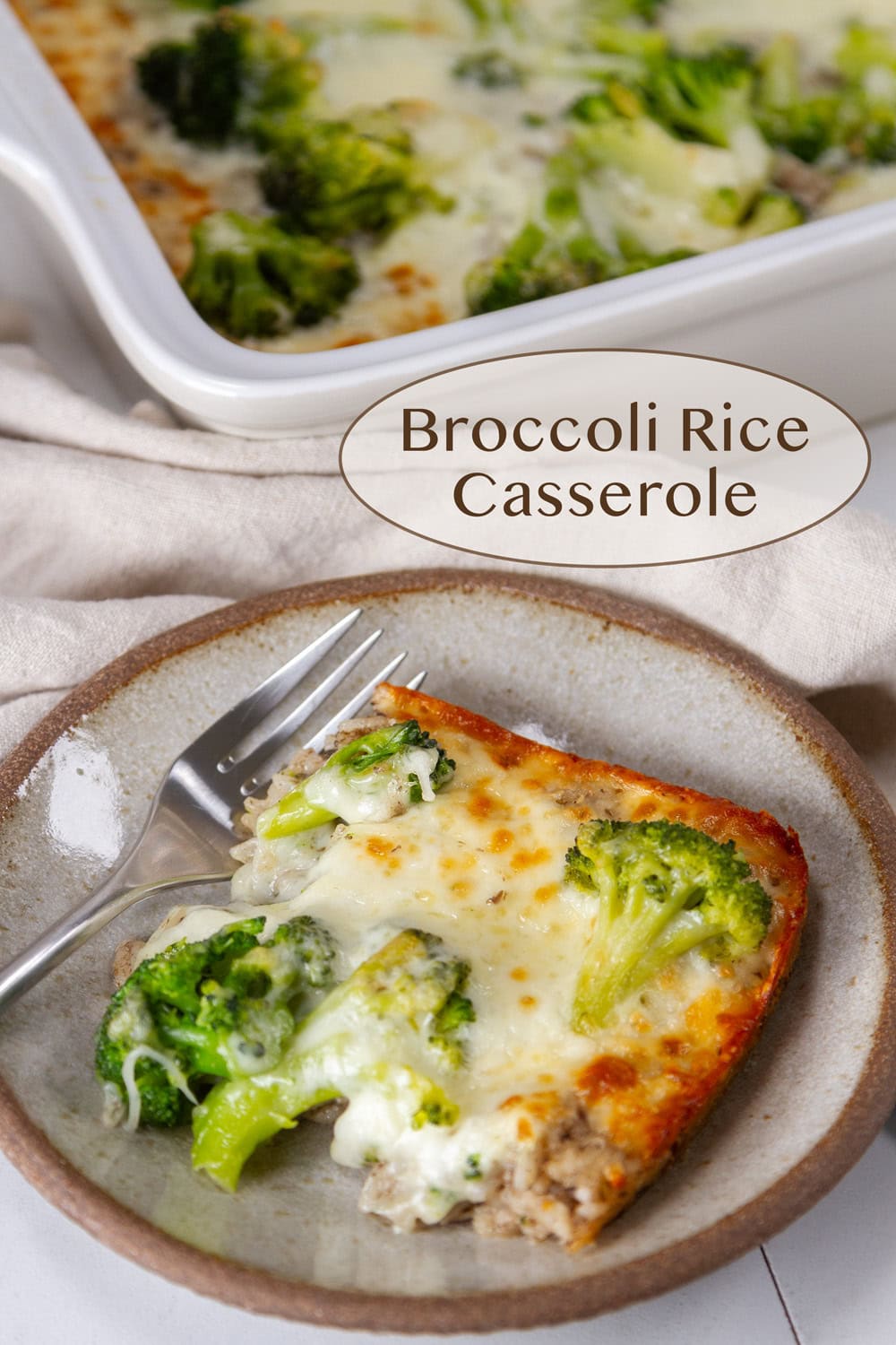 a piece of broccoli rice casserole on a plate in front of the whole casserole dish.
