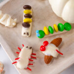square crop of candy made into bug shapes and decorated for Halloween.