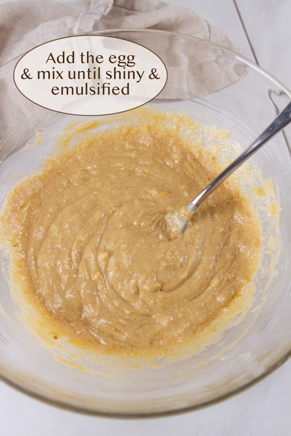 cookie batter in a glass bowl with a fork.