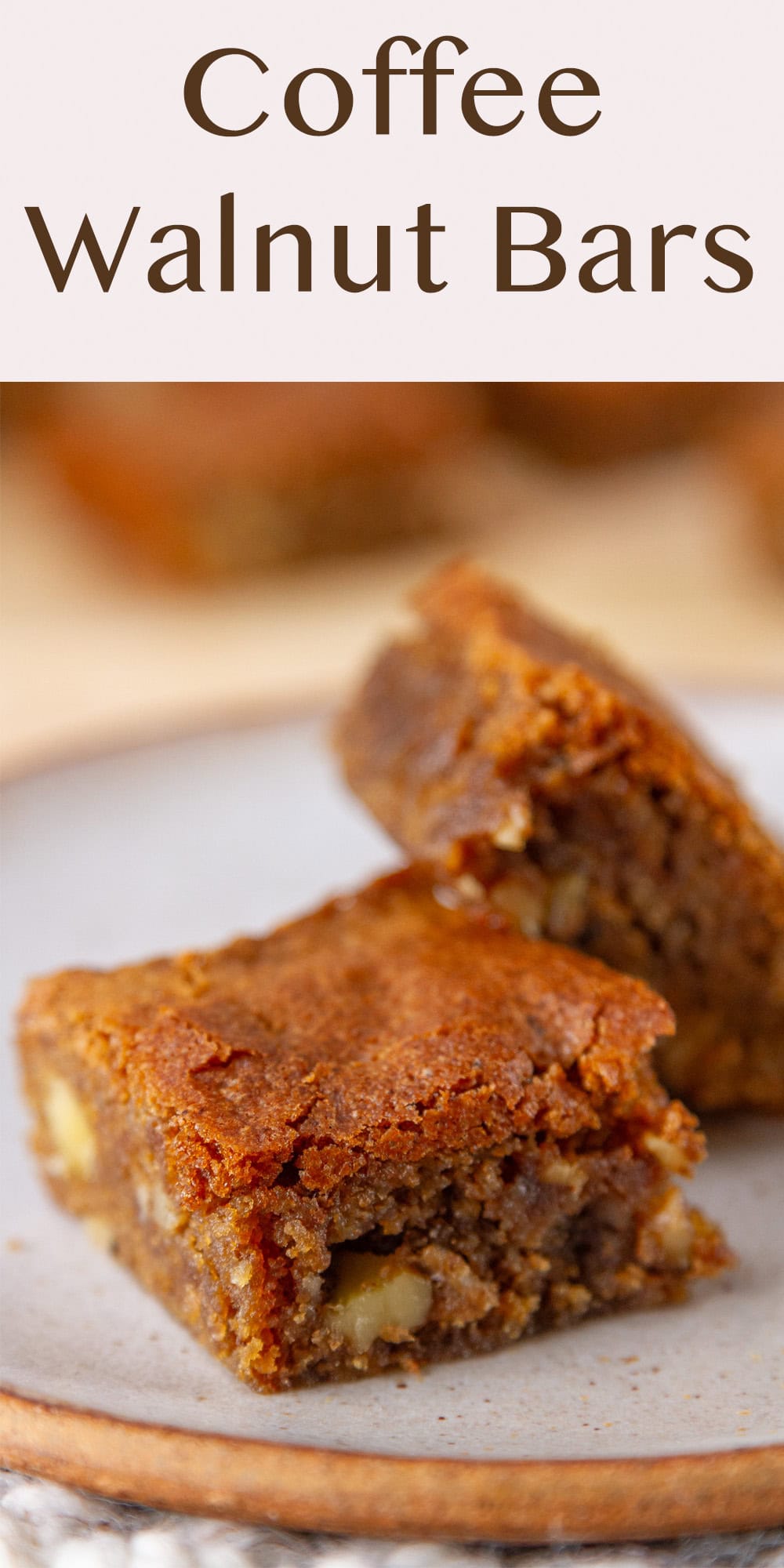 close up on two cookie bars like blondies on a white plate.