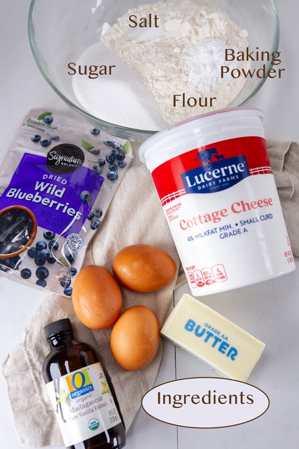ingredients for cake on a white counter.