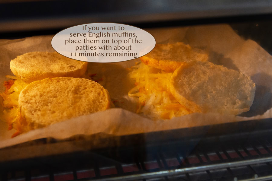 English muffins on top of hashbrowns in the toaster oven.