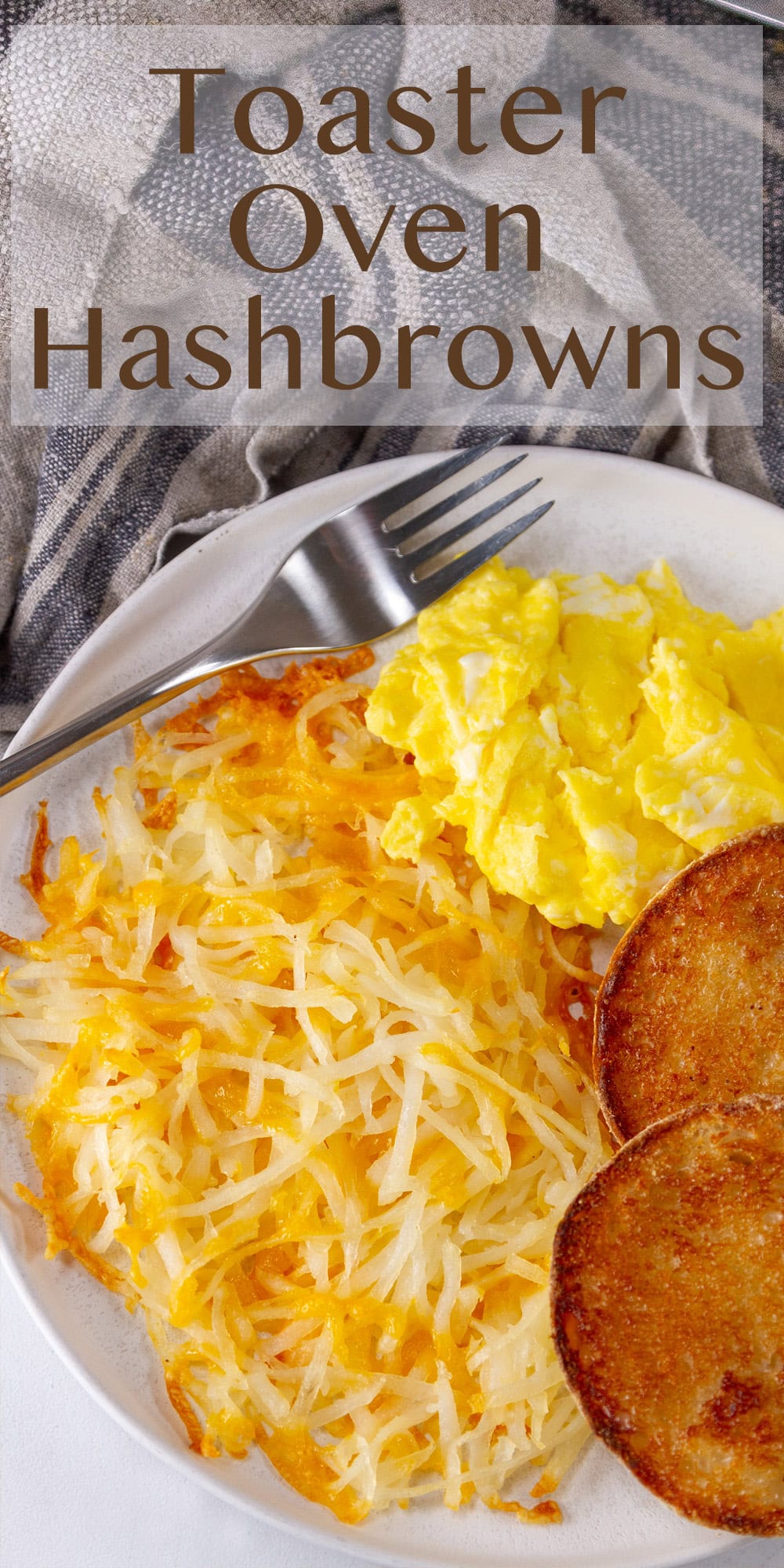 a plate with breakfast of hash browns, scrambled eggs, and an English muffin.