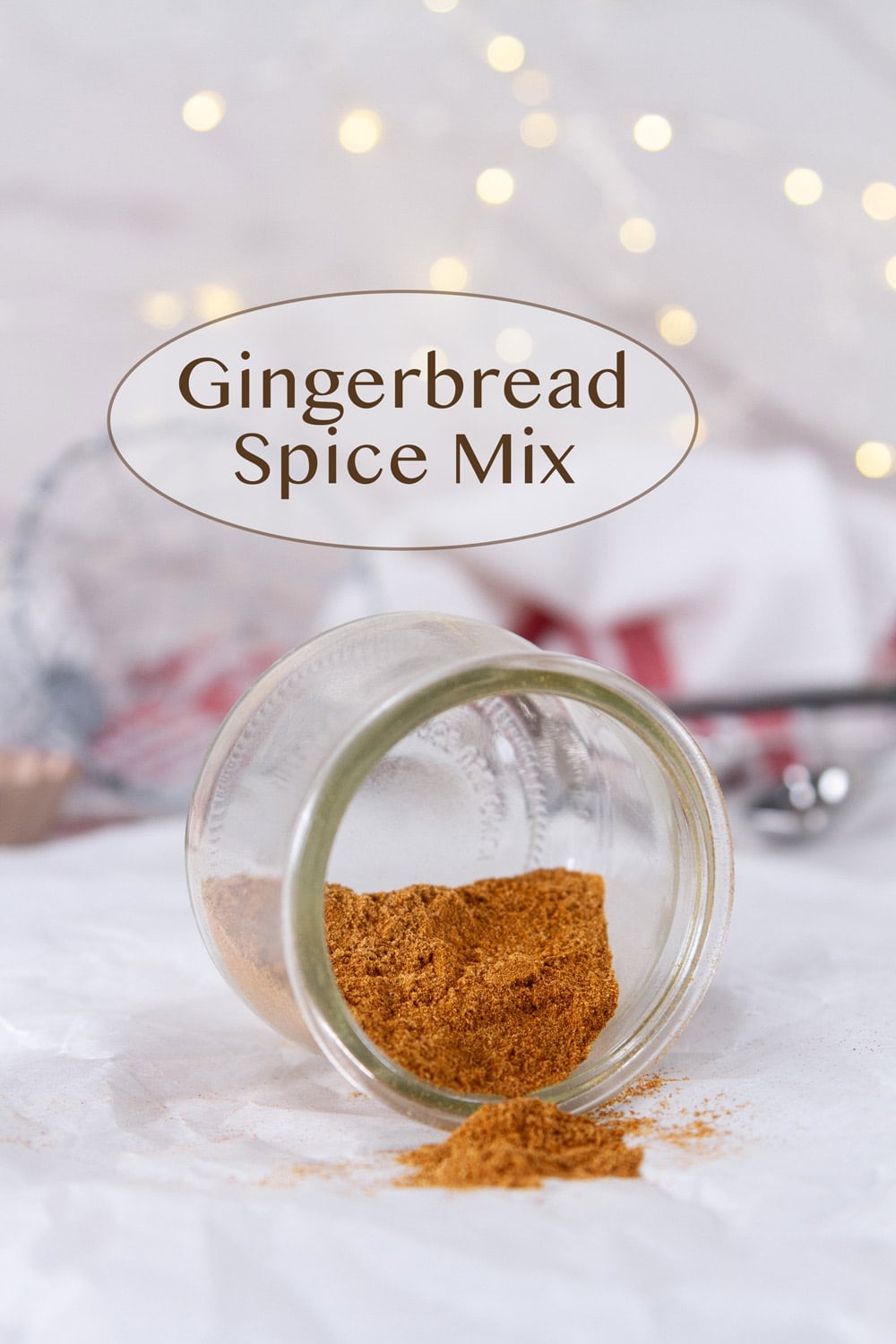 a jar of gingerbread spice mix on its side to she the spices.