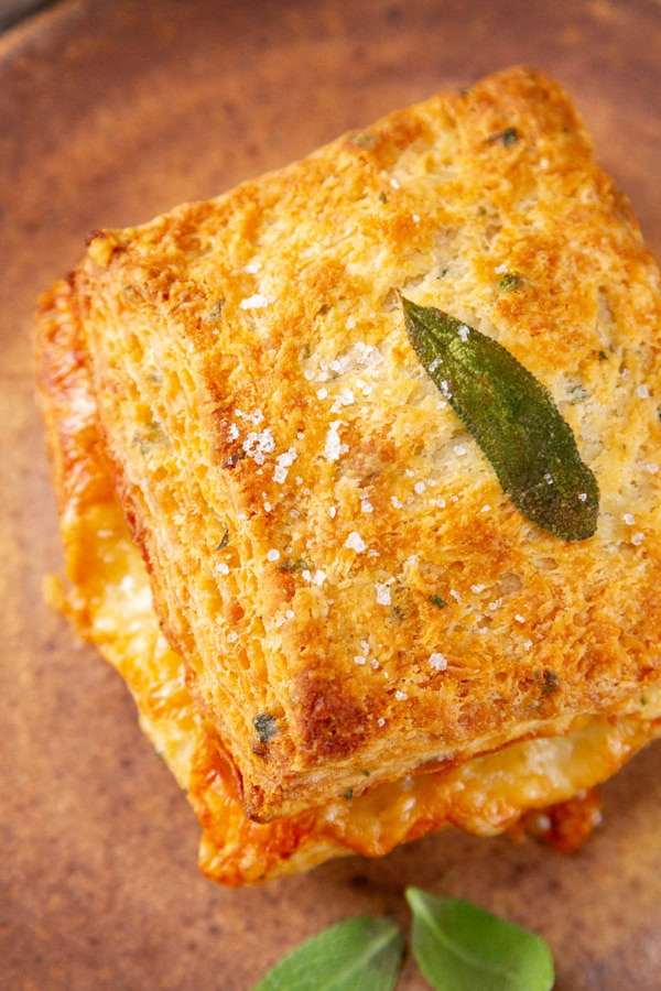 looking down on a biscuit on a brown plate.