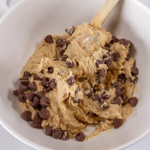 cookie dough in a bowl with a spatula.