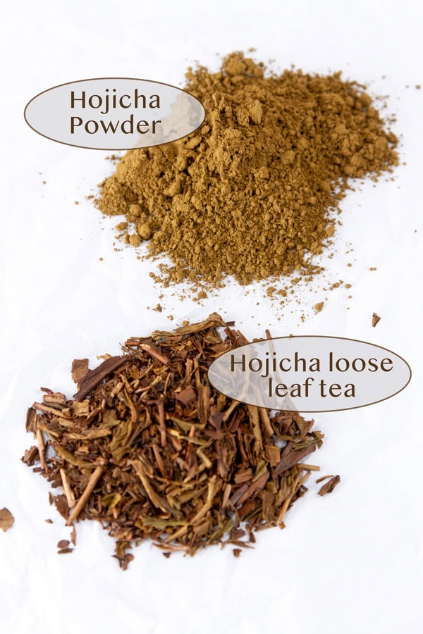 a pile of hojicha powder in back and hojicha loose leaf tea in front.