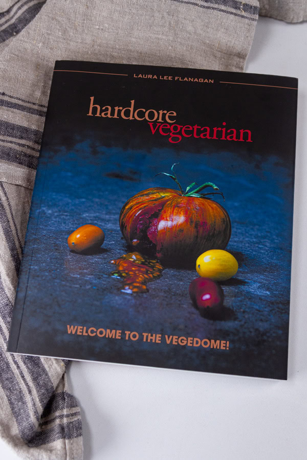 The cookbook Hardcore Vegetarian: Welcome to the Vegedome! on a cloth towel.