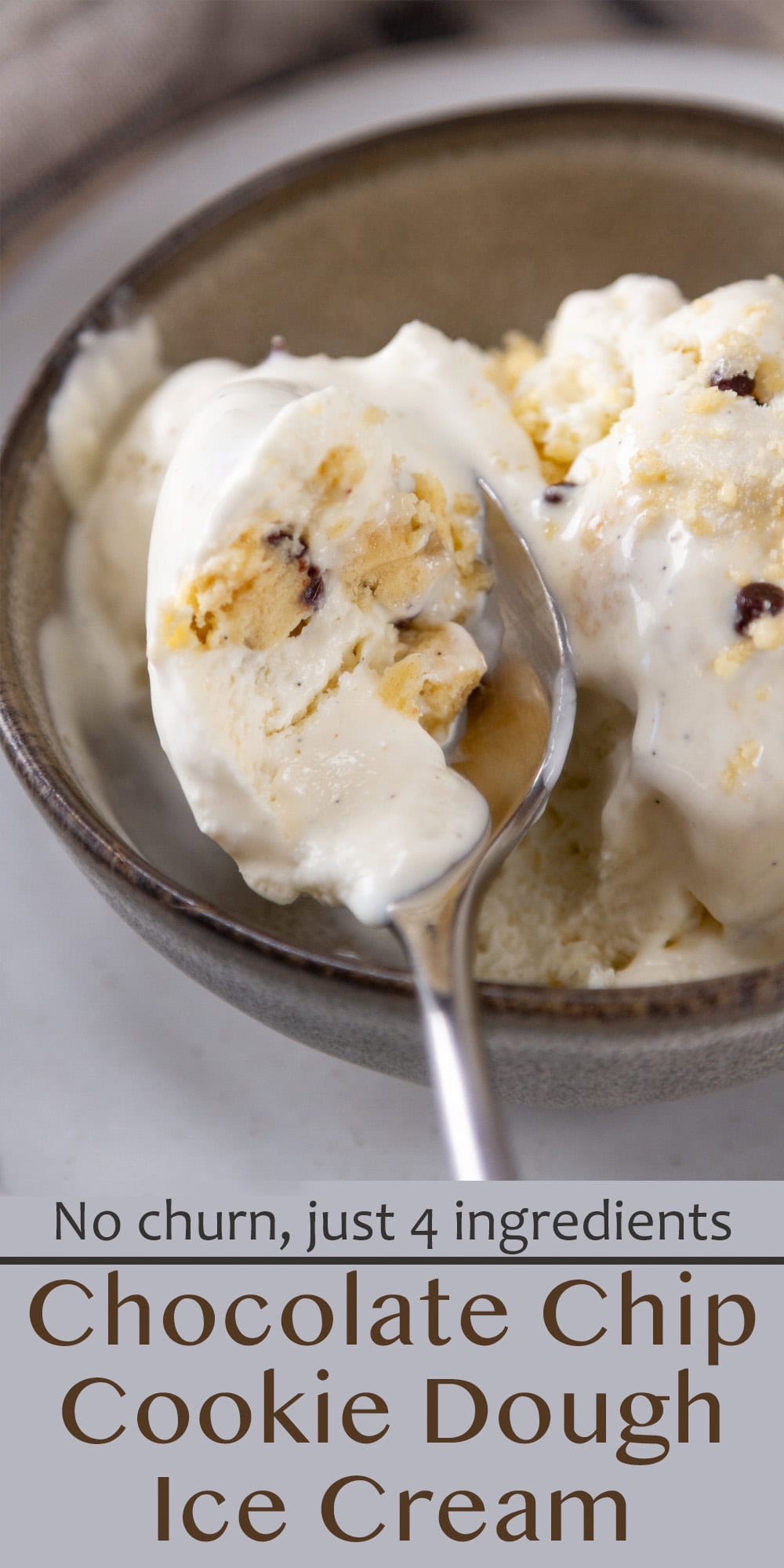 a spoon with a bite of ice cream on it on top of the bowl of ice cream.