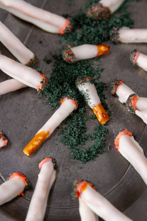 close up on the candy cigs on a plate.
