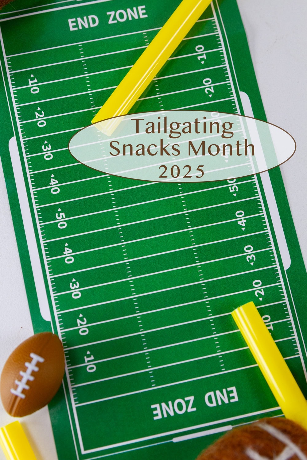 a football field printed on paper with small footballs and goal posts.