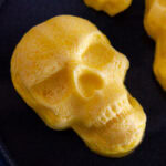 square crop of egg bites baked into a skull shape.