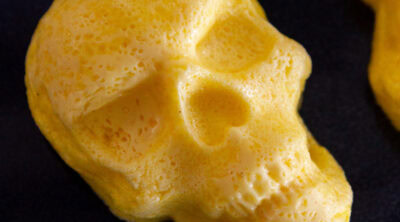 square crop of egg bites baked into a skull shape.