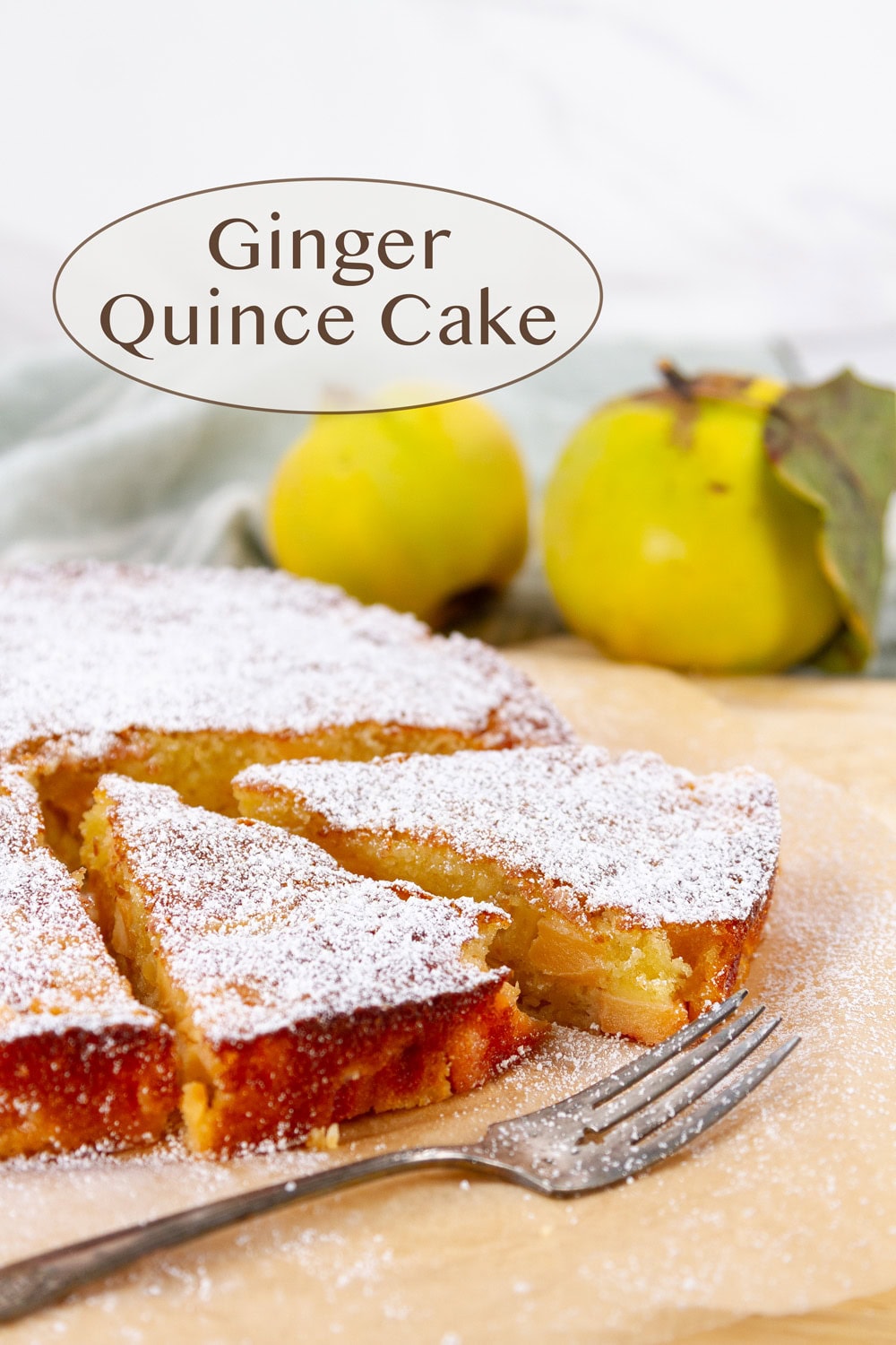 a sliced ginger quince cake with quince in the background and a fork in front.