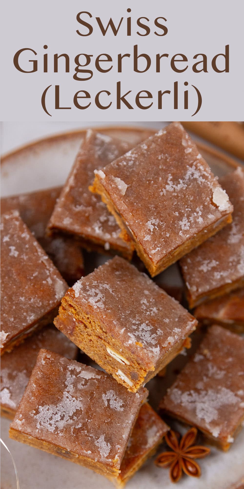several bars of gingerbread stacked on a plate.