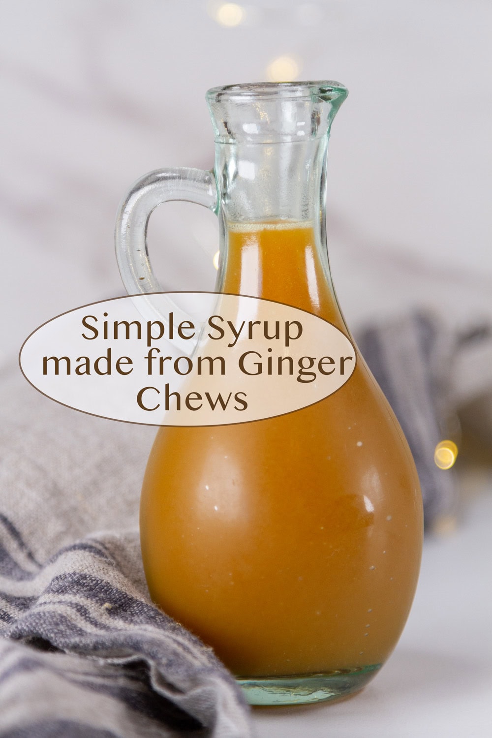 a glass bottle filled with ginger simple syrup.