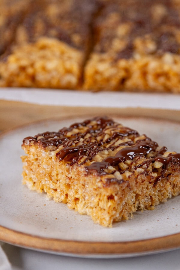 a square taken from the pan of rice crispy treats.
