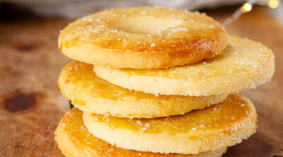 a stack of Danish salted butter cookies on a wooden tray.