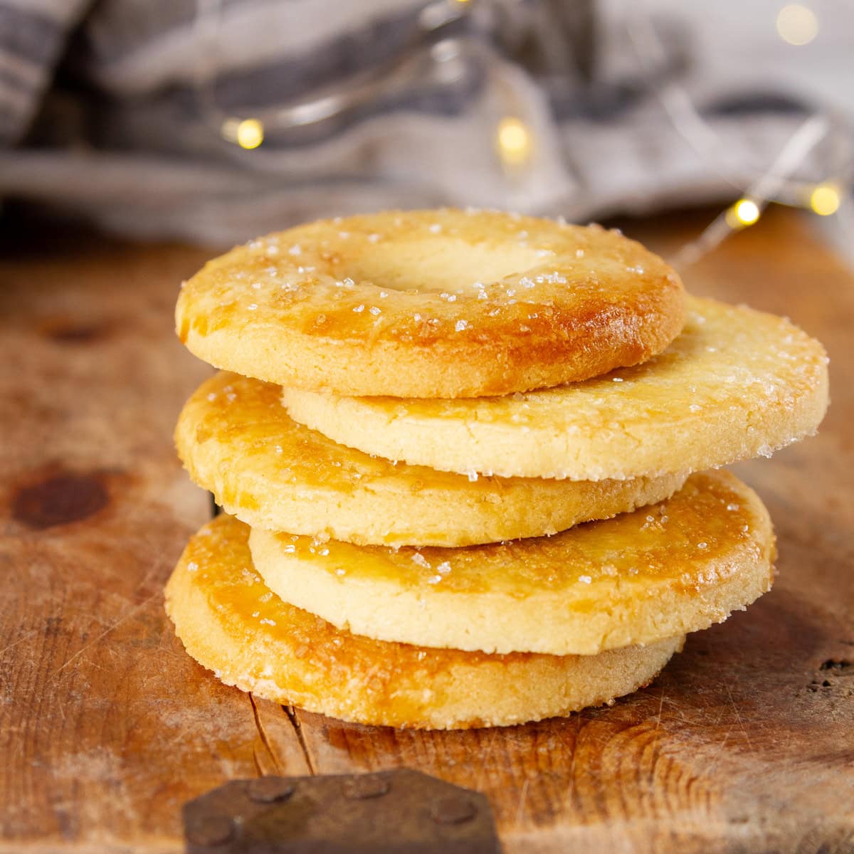 a stack of Danish salted butter cookies on a wooden tray.
