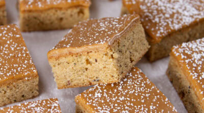 square crop of dirty chai bars on a piece of parchment paper.