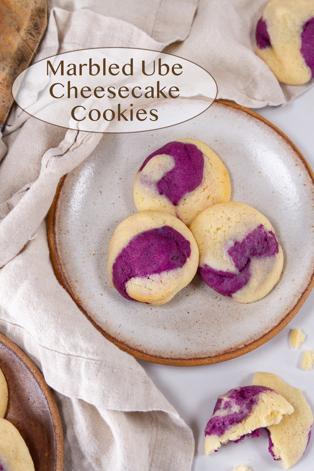 a plate of ube cookies with a cloth napkin by them.
