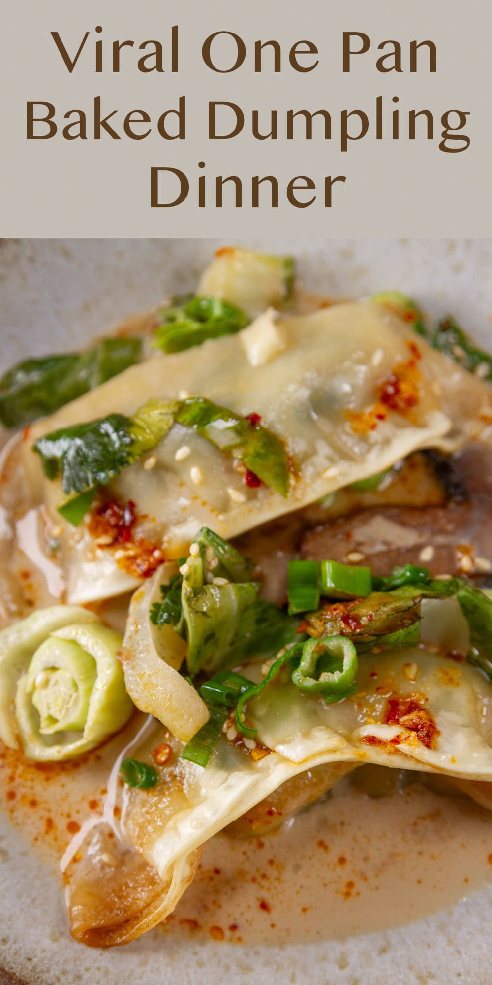 two dumplings, bok choy, and mushrooms baked in sauce on a plate.