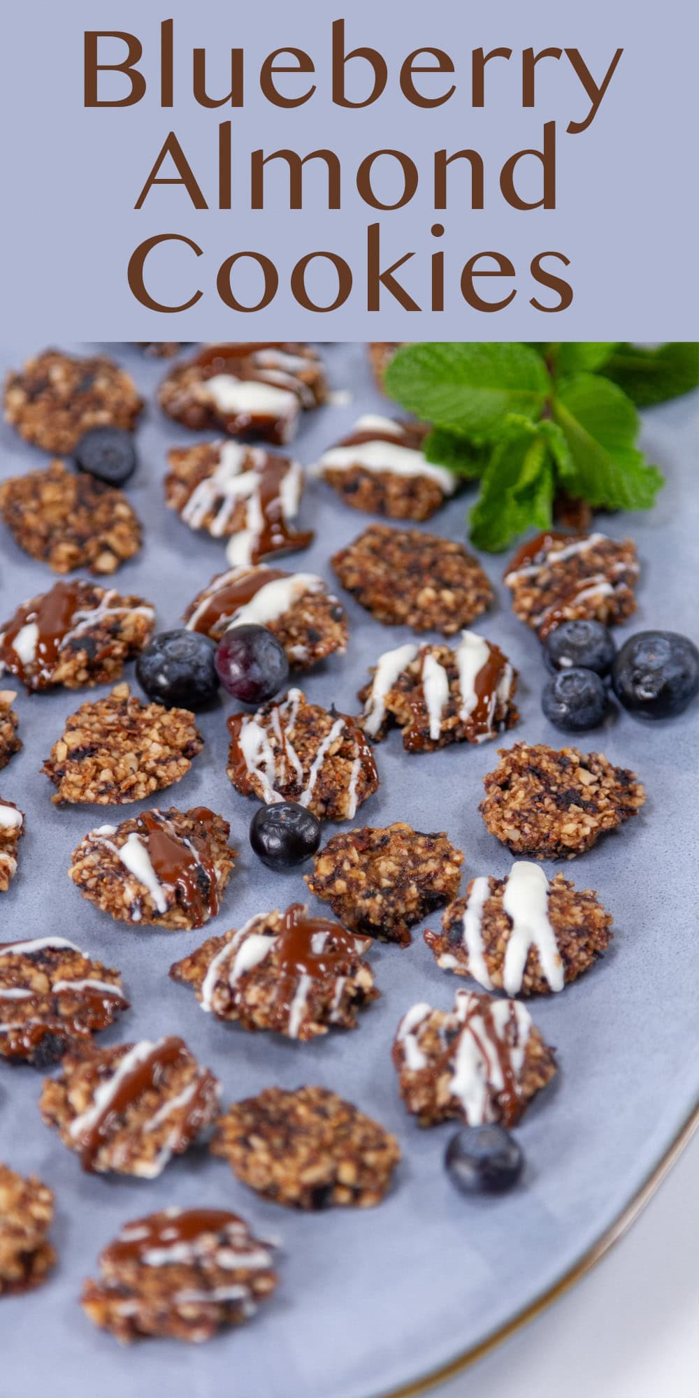 a blue platter with lots of little cookies on it.