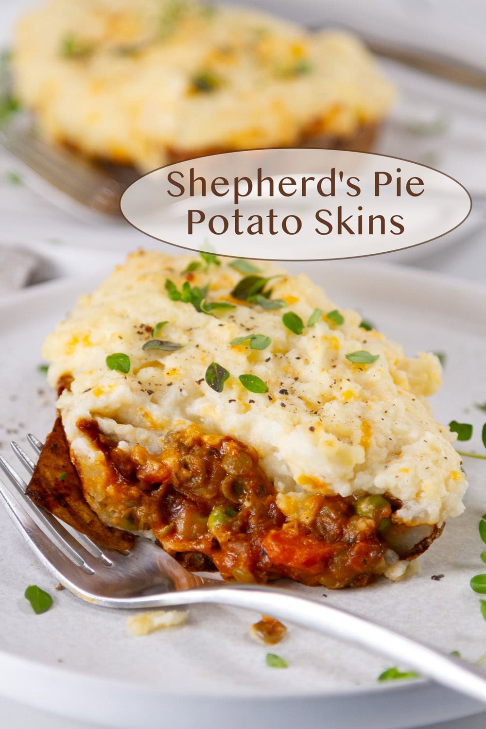 a Vegetarian Shepherd's Pie Potato Skin cut open so you can see the inside and a fork next to it.