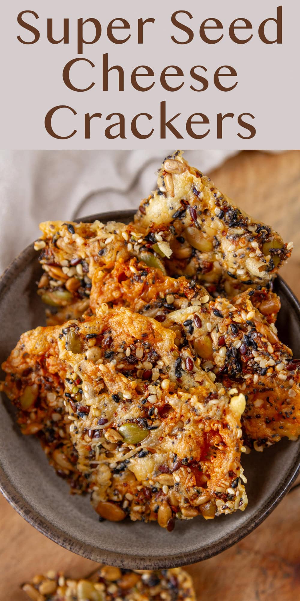 looking into a bowl filled with seed crackers.