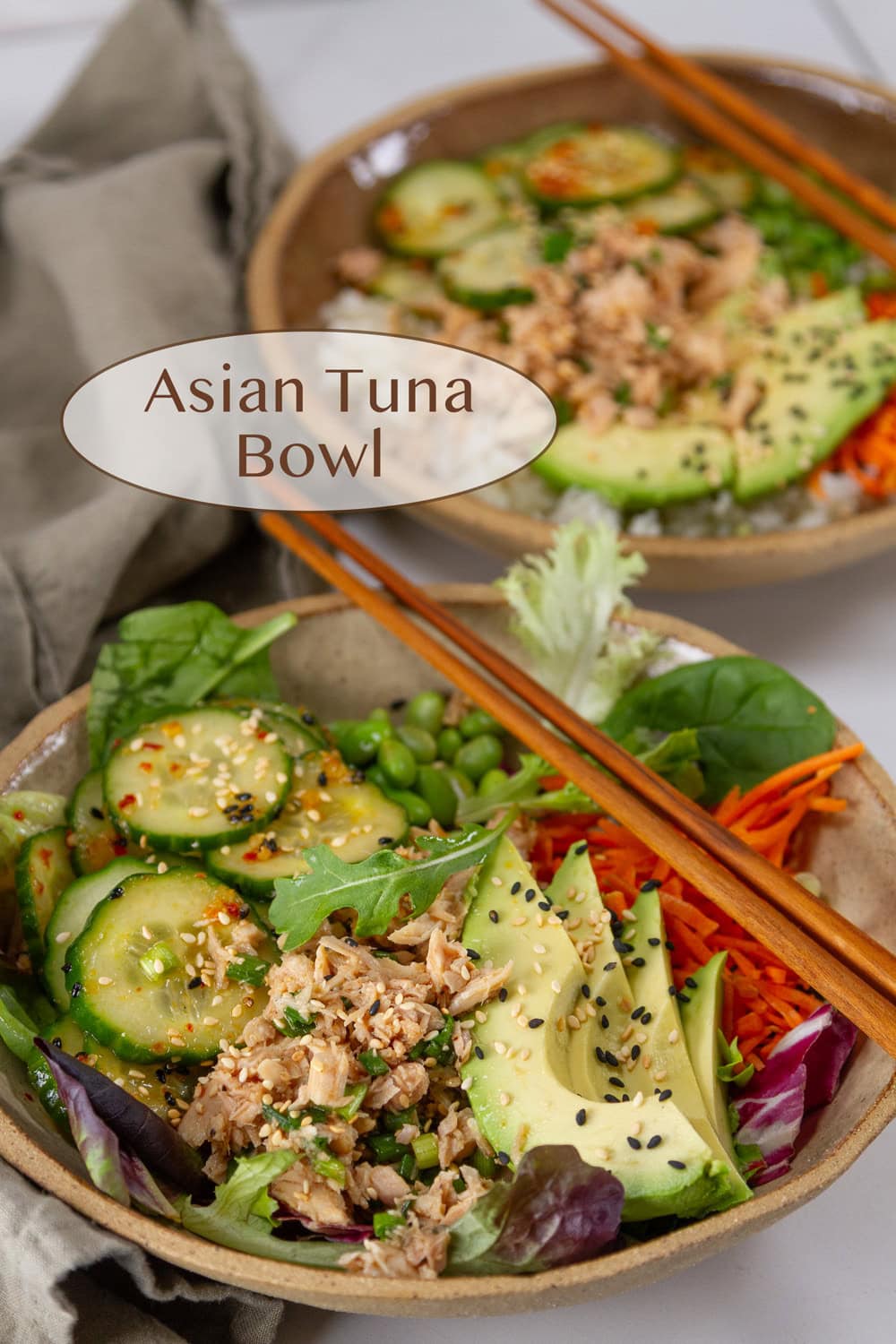Healthy Asian tuna bowl with fresh vegetables and sesame seeds.