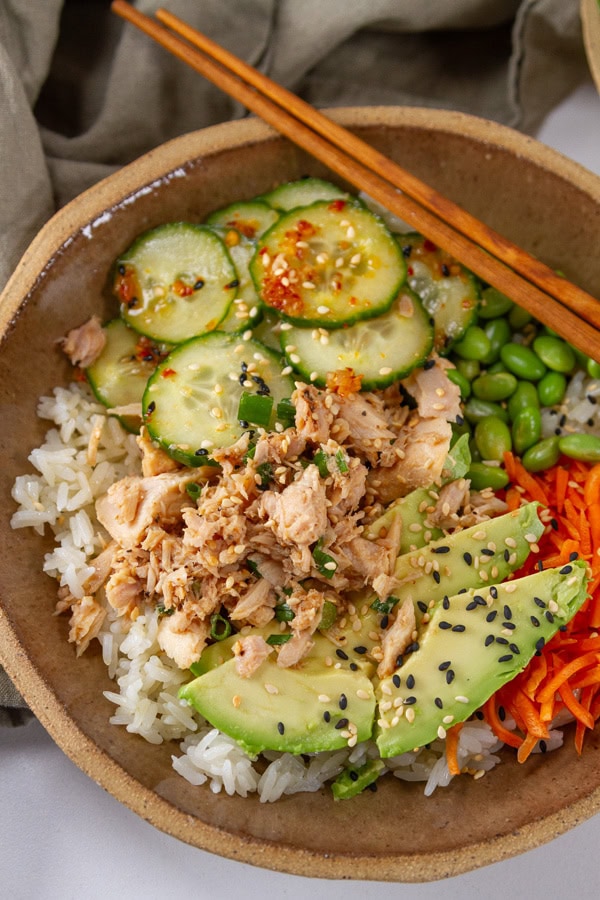 a tuna rice bowl with chopsticks in the upper right.