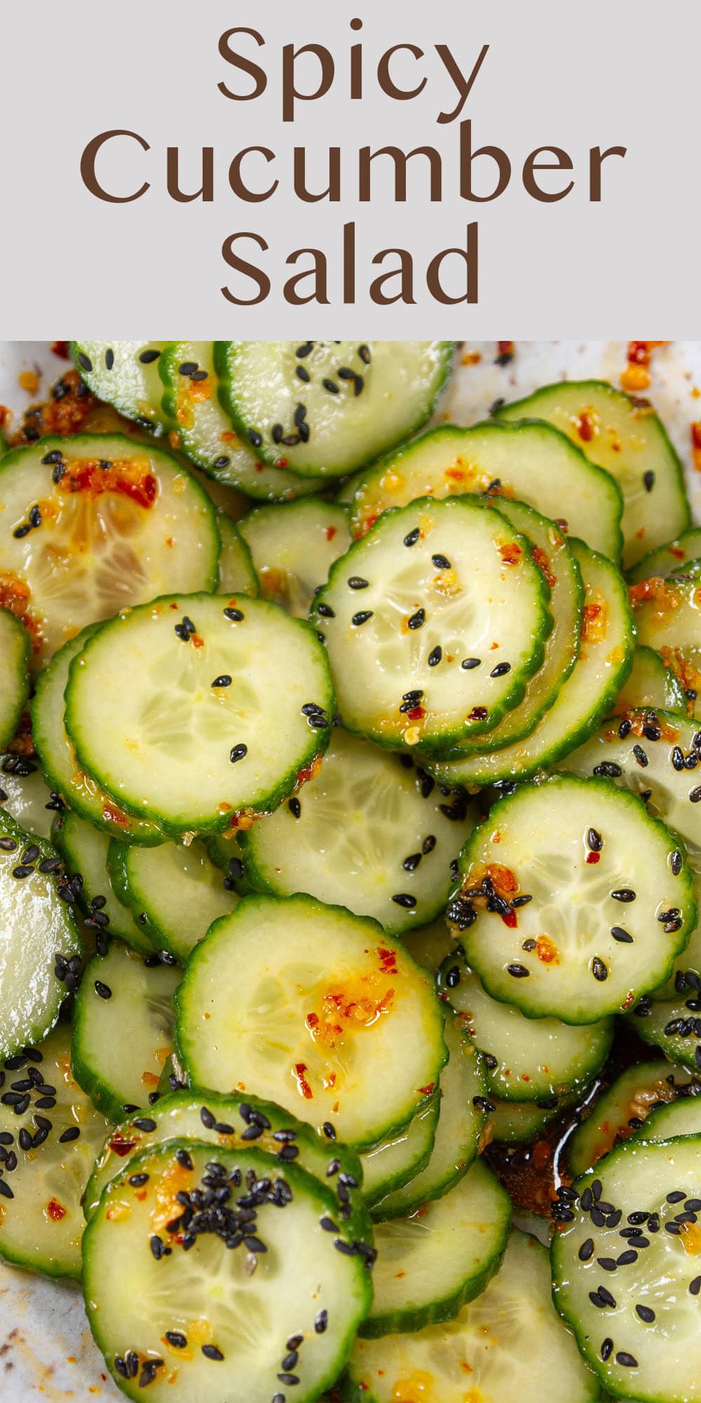 close up on sliced cucumbers with dressing.