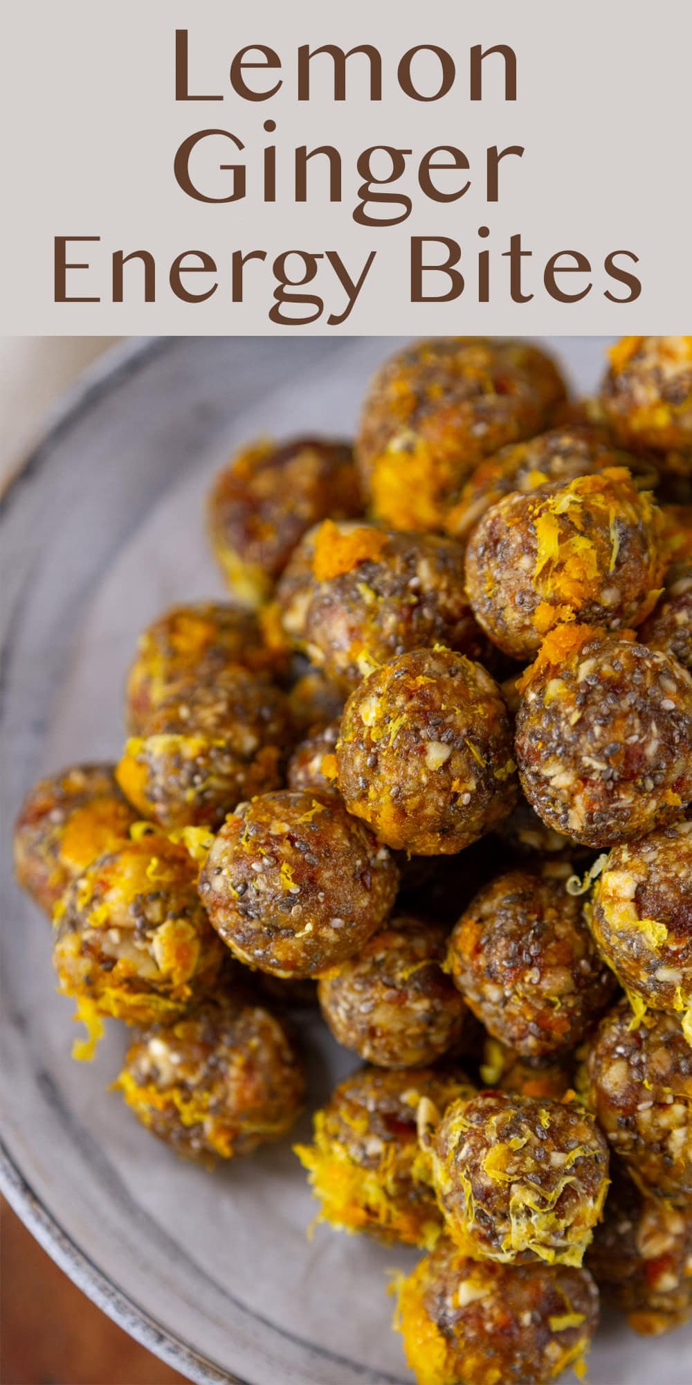 citrus energy bites piled in a stack on a serving plate.