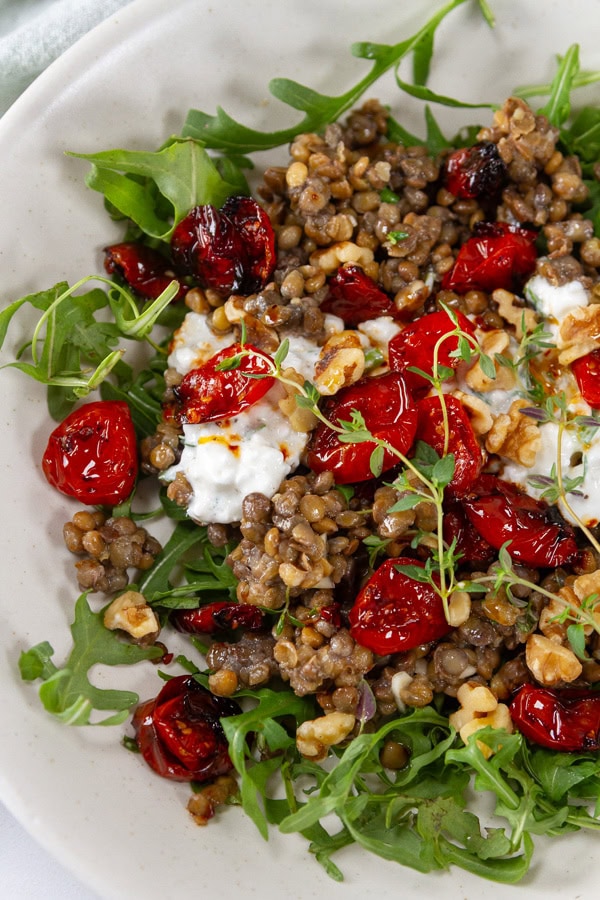 lentils served over arugula like a salad bowl.