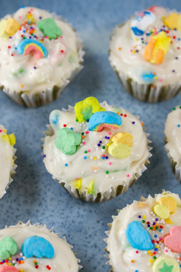 cheesecakes made in muffin cups on a blue platter.