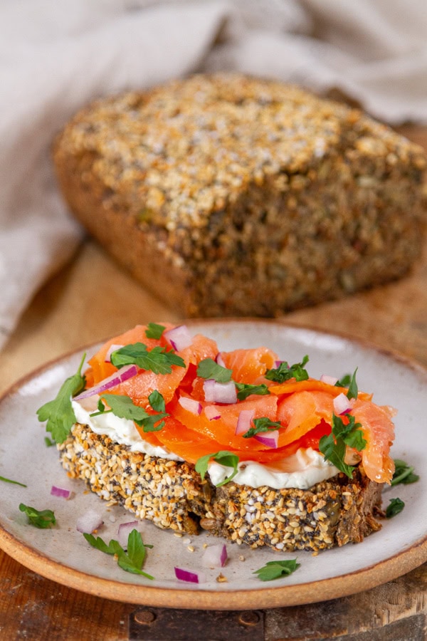seed bread with cream cheese, smoked salmon, and fresh parsley.