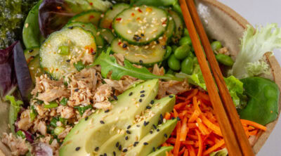 square crop of a healthy Asian tuna bowl with chopsticks on the right.