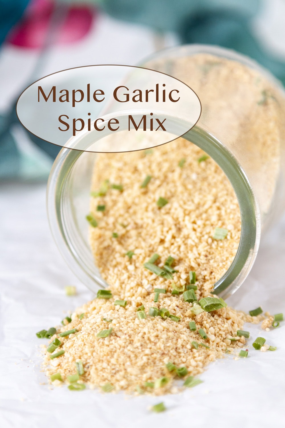 a small glass jar filled with spice mix that has been tipped on its side.