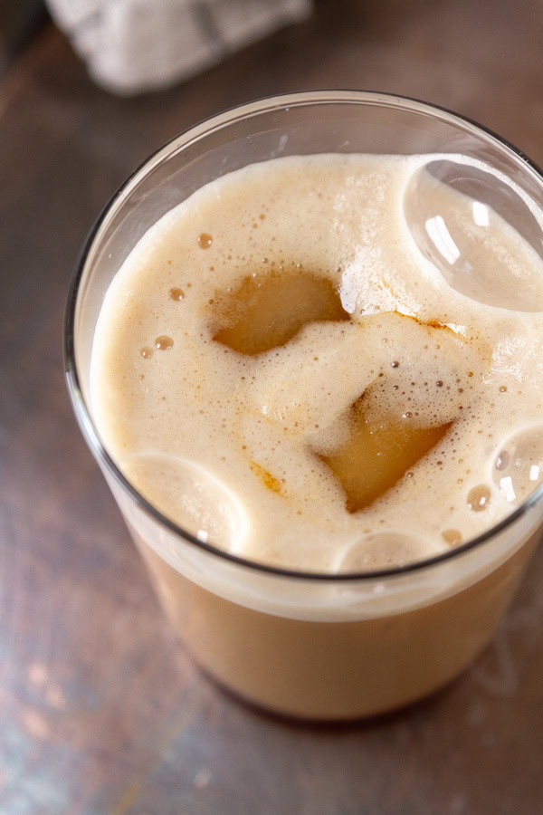 looking down into an iced latte with Earl Grey syrup.