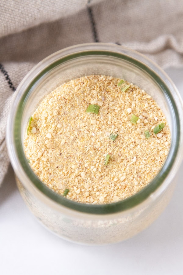 looking down into a glass jar of spices.